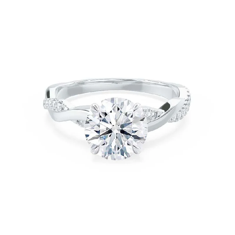 Marquise - cut diamond engagement ring with a split - shank band in platinumEDEN - Moissanite & Diamond 18k White Gold Vine Solitaire