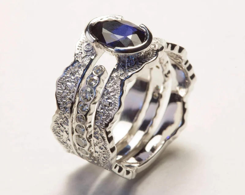 Emerald - cut diamond engagement ring set in a modern titanium bandBlue Sapphire and Diamond Lace Engagement Ring Set