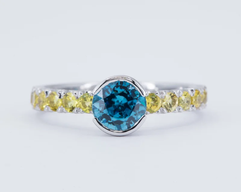 Aquamarine and diamond engagement ring in a 18K white - gold setting with a scalloped edge1.58 ct Blue Zircon Engagement Ring with Yellow Sapphires - Size 7