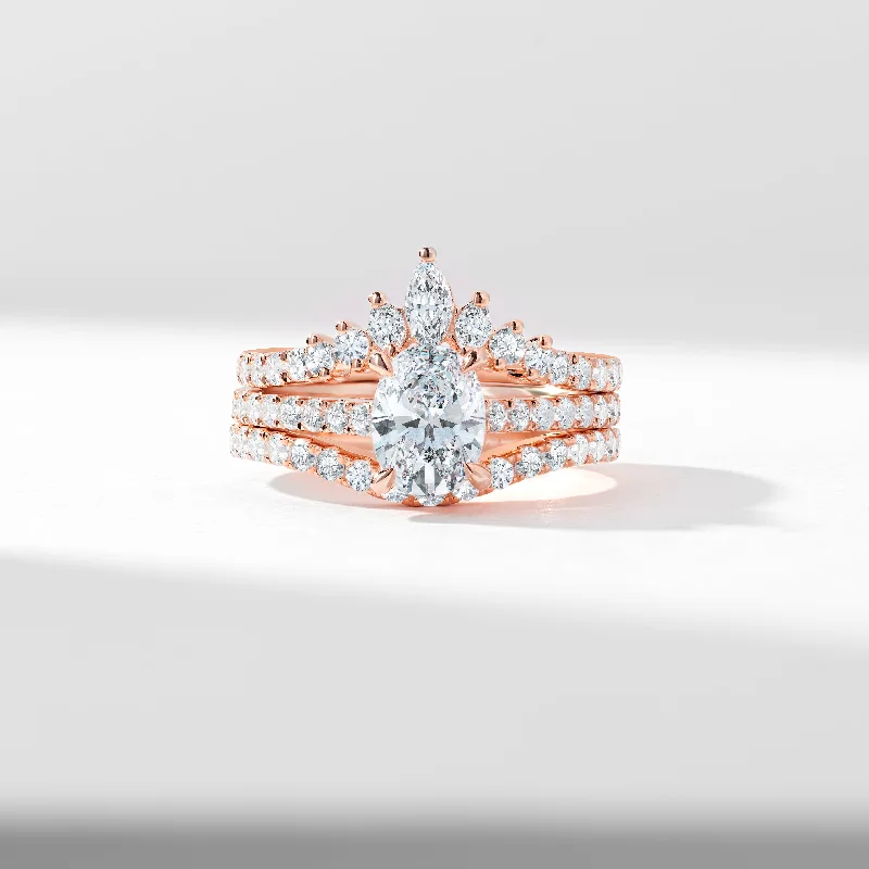 Three - stone diamond engagement ring in rose gold, symbolizing past, present, and future1.25ct Oval Moissanite Centre With Marquise And Round Brilliant Contoured Wedding And Eternity Rings Bridal Set 2.0tdw