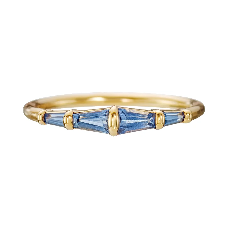 Art Deco - Inspired Wedding Bands with Geometric Patterns in Platinum for a Retro and Glamorous StyleBlue Sapphire Tapered Baguette Gold Bar Ring